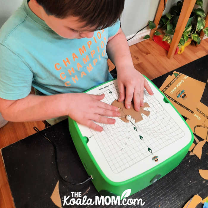 Photo of boy using his BeaverBot C2 cutter by Bonnie Way.